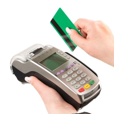 female-hand-holding-credit-card-through-terminal